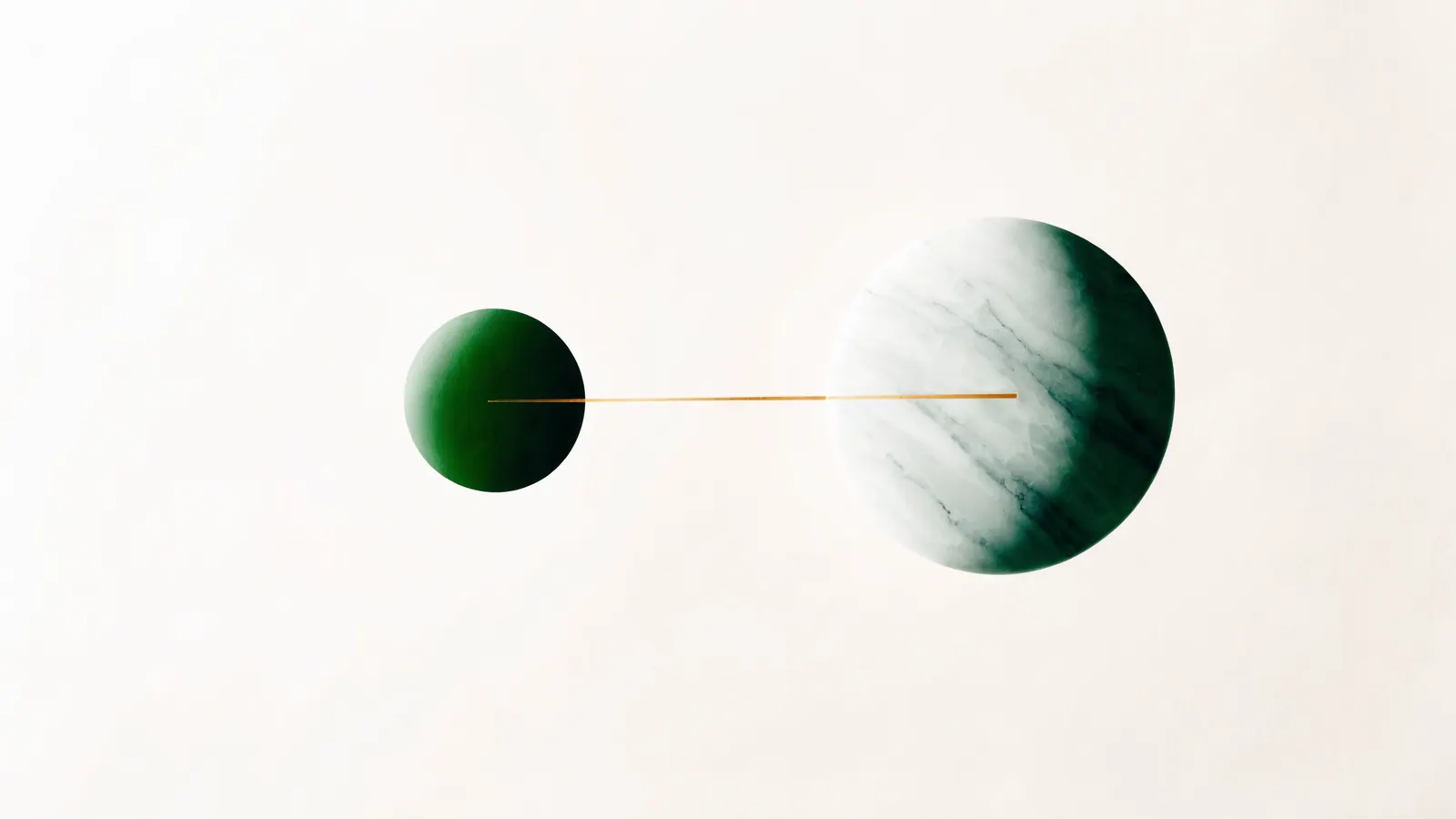 A small green disc and a large stone disc connected by a taut amber line